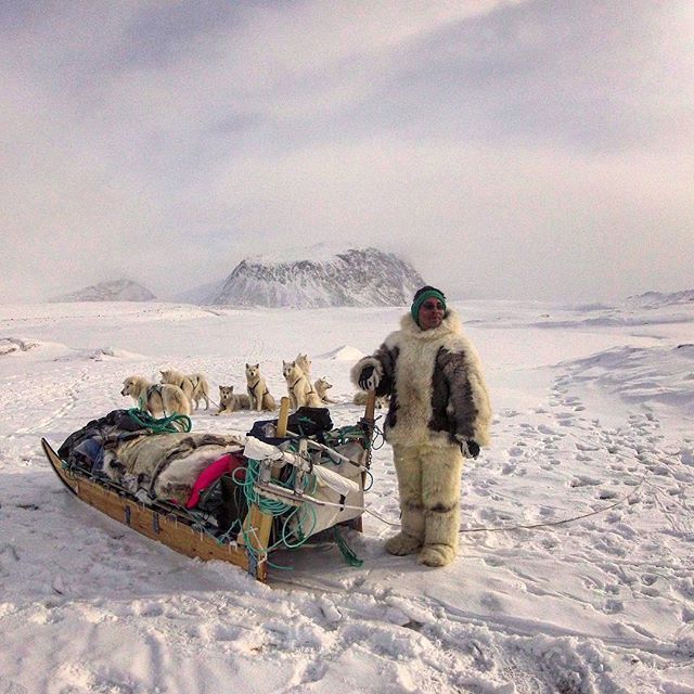 inuit people and dog